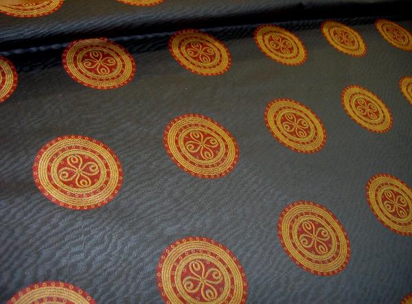 angle view Black Moire Fabric with Gold and Red Medallions Workroom Remnant Upholstery Weight