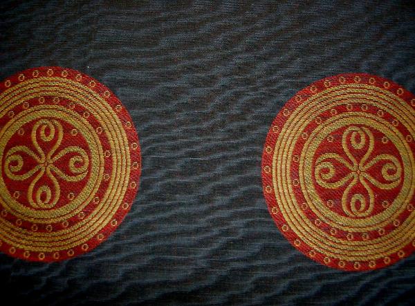 closeup Black Moire Fabric with Gold and Red Medallions Workroom Remnant Upholstery Weight