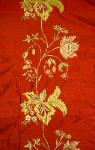 Closeup of embroidered side border of this silk fabric for draperies