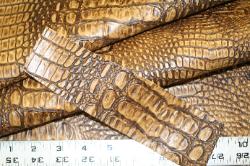 Get a Swatch of this crocodile design vinyl upholstery fabric, in check out use shipping option Swatch only - free shipping 