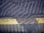 swatch of bargain vertical stripe semisheer drapery fabric in closeout section of store
