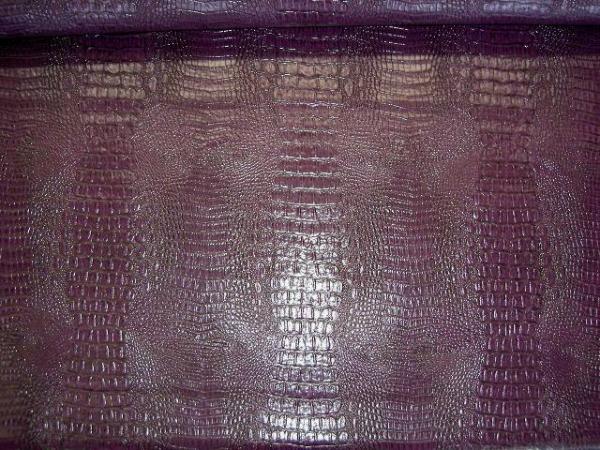 Table view Fabric Store Designer's Special Faux Crocodile Skin Upholstery Vinyl Color Plum by the yard